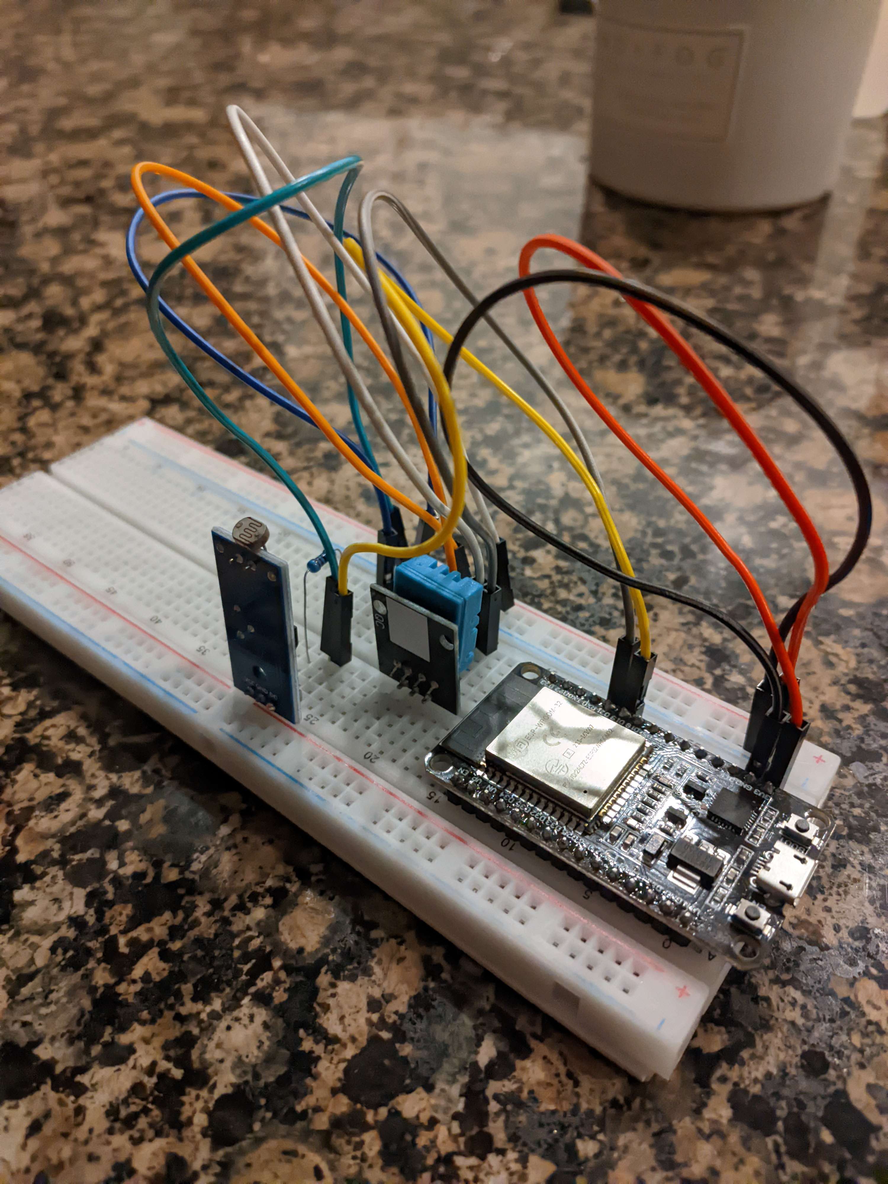 Esp 32 device with DHT11 and photoresistor module